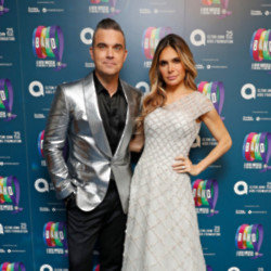 Ayda Field has insisted that she and husband Robbie Williams are still intimate together