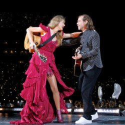Taylor Swift and Aaron Dessner performing on The Eras Tour