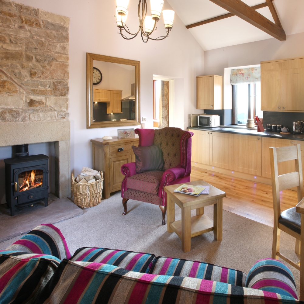 The living room, dining and kitchen area of Oak Cottage