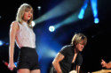 Keith Urban is addicted to Ariana Grande's latest hit and loves Taylor Swift's new album