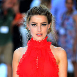 Amber Heard is happily signing her autograph in her new home of Madrid amid reports she may make a Hollywood comeback ‘for the right project‘