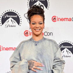 Rihanna has posed for a topless maternity shoot she called ‘Rub on ya t******‘