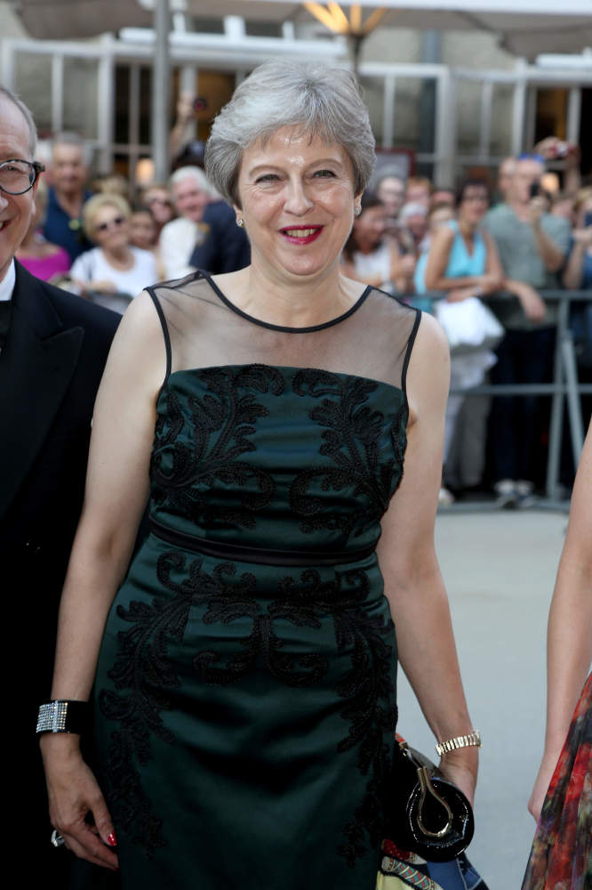 Theresa May in what may be described as happier times / Photo Credit: babirad/FAMOUS