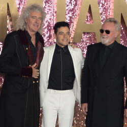 Rami Malek with Brian May and Roger Taylor at the Bohemian Rhapsody world premiere / Photo Credit: JW/Famous