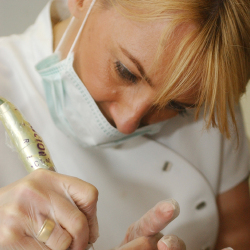 Karen Betts performs an eyebrow tattoo treatment
